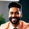 Hombre afro con barba y corte fade sonriendo, viste traje naranja y corbata en ambiente corporativo.
